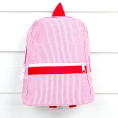 The cutest children's sized backpacks in a variety of sweet seersuckers, plaids and prints! Just perfect for that first day of school, camp and beyond! Choose from Small or Medium. Small backpack measures 8.5" x 11"Medium backpack measures 11.5" x 15" **This item is not eligible for gift wrap** Red Standard Backpack For School Events, Red Backpack For School Events, Red Backpack For School Events At Year End, Red Backpack For End Of School Year Events, White Preppy Backpack, Red Backpack For End-of-school-year Events, Playful Red Backpack For Everyday Use, Back To School Gingham Backpack For Everyday Use, Gingham Backpack For Everyday Use And Back To School