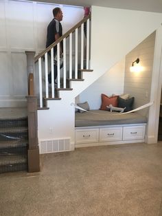 a man standing at the top of a stair case