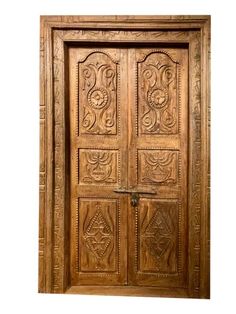 an old wooden door with intricate carvings on the front and side doors, which are made from