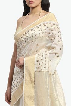 Ivory chanderi saree embroidered with golden threads and pearls. Comes with running blouse piece. - Aza Fashions White Chanderi Pre-draped Saree With Zari Work, White Chanderi Pre-draped Saree For Celebration, White Cotton Silk Pre-draped Saree For Festivals, Gold Chanderi Pre-draped Saree With Dori Work, Traditional Off White Chanderi Pre-draped Saree, White Cotton Silk Pre-draped Saree With Zari Work, White Silk Pre-draped Saree With Zari Work, Wedding Tussar Silk Blouse Piece With Gota Work, Tissue Silk Pre-draped Saree With Dori Work For Celebrations