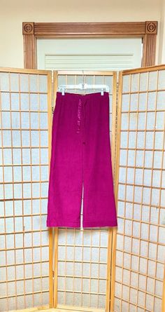 Sweet & unique pair of 80s fuchsia pink vintage corduroy pants. Stretch waistband with pink satin ribbon ties.  Wide legs. Raw cuff hems. 💥Condition: Excellent vintage condition. Raw hems.  💥Approximate Measurements (lying flat; unstretched): Waist Width: 14" Inseam: 30" Please be sure the approximate measurements are a good fit for you. We're happy to answer questions or provide additional photos and measurements upon request.  Every effort is made to accurately describe the condition of our items and their measurements. Unless otherwise noted, our vintage items all led a previous life, and may tell their life stories through "perfect imperfections".  Purchasing vintage supports resource sustainability and shows CONSCIOUS POSITIVITY for our precious planet! 💖  All items are sold As Is Pink Wide Leg Corduroy Pants, Corduroy Pants, Pink Satin, Waist Tie, Satin Ribbon, Trousers Women, Vintage Pink, Unique Vintage, Capri