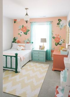 a bedroom with two beds and a rug in front of the bed is painted peach