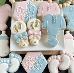 baby shower cookies are arranged on a plate