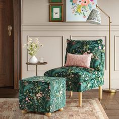 a green chair and ottoman in a living room