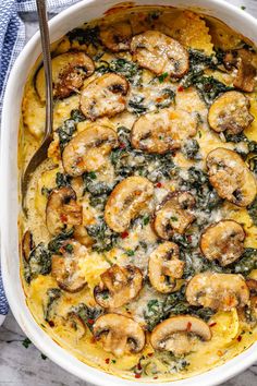 a casserole dish with mushrooms and spinach