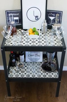 a black and white tiled table topped with drinks