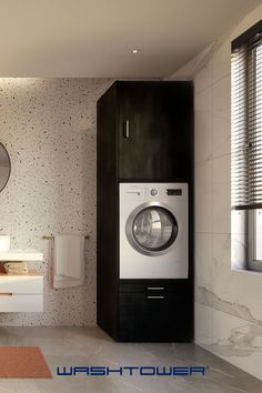 a bathroom with a washer and dryer in it