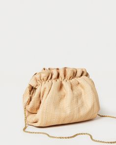 Gathered mini frame clutch in natural raffia. Features a removable twisted gold chain crossbody strap, frame closure, and full lining. Woven Crossbody Clutch, Gold Summer Travel Clutch, Chic Natural Clutch For Formal Occasions, Elegant Natural Color Party Clutch, Elegant Natural Color Clutch For Party, Elegant Natural Clutch For Party, Elegant Beige Woven Clutch, Chic Gold Evening Bag For Summer, Elegant Natural Pouch Clutch