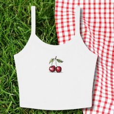 We love this fun, colorful Cherry design Baby Tank! This adult sized tank top is soft and super comfy and is made of 52% cotton and 48% polyester for a luxurious lightweight stretch. The designs are printed with DTF which delivers a vivid, detailed design with a textured feel. This tank is a perfect blend of coquette fashion and nostalgic Y2K vibes, making it a trendy addition to your casual wardrobe. Made with soft, comfortable material, it's ideal for everyday wear or for making a statement at Y2k Letter Print Tank Top For Spring, Y2k Style Letter Print Tank Top For Spring, Red Cartoon Print Top For Spring, White Sleeveless Letter Print Crop Top, Casual Red Tank Top With Letter Print, Trendy White Vest Crop Top, Trendy White Vest-style Crop Top, Y2k Style Cotton Tops With Cherry Print, Red Cartoon Print Top For Summer