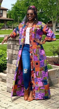 YKimono jacket with pockets made from African prints. Our Ankara duster showcases colorful mixed designs in patchwork patterns, which combine different symbols and images from a variety of African fabrics.  Everything in our shop will be handmade for you in your measurements, so simple adjustments can be accommodated at no additional cost.  Upon ordering,  please send your height or preferred length while ordering. The featured length is 58". The model is 5'7" *Matching headwrap or waist tie ava African Print Kimono, Ankara Kimono, Kimono Outfits, Patchwork Kimono, Plus Size Kimono, Mode Kimono, Long Duster, Kimono Robes, African Fabrics