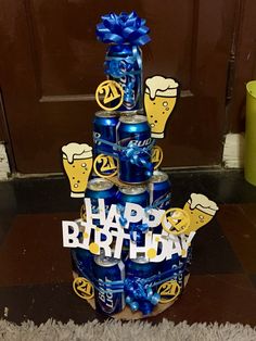 a birthday cake made out of beer cans