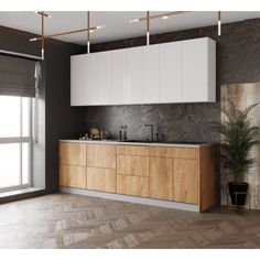 an empty kitchen with white cabinets and marble counter tops