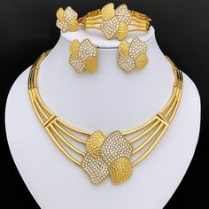 Afraic Jewelry -Gold Color Jewelry Set For Women Inlays White Rhinestone Necklace Earrings Bracelets Rings Set Wending Party Gift material: Zinc alloy key words: bowknot Shape Jewelry for women Inlays White Rhinestone Alloy Necklace Style: African fashion 4 piecese jwelry set for women Style: TRENDY Shape\pattern: Butterfly Production process: Three times in the plating Plating color: gold Origin: Mainland China Occasion: Engagement Model Number: 170 Metals Type: Zinc alloy Material: Metal MOQ: 1Set Jewelry Sets Type: Necklace/Earrings/Ring/Bracelet Item Type: Jewelry Sets Included Additional Item Description: Necklace earring ring bracelet Gender: Women Model Number:3256803884042116 Product information: Material:Zinc alloy Color: Gold Color Product Package Details: 1 Set (Neckace, Bracele Rhinestone Alloy Jewelry Gift, Alloy Rhinestone Jewelry For Gift, Gold Rhinestone Costume Jewelry, Gold Plated Rhinestone Jewelry For Wedding, Gold Crystal Costume Jewelry Sets, Gold Alloy Jewelry With Rhinestones, Gold Rhinestone Alloy Jewelry, Costume Jewelry Sets With Rhinestones For Gifts, Costume Jewelry With Rhinestones For Gifts