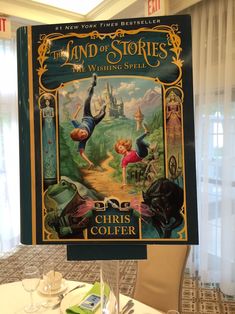 the land of stories book on display in a restaurant