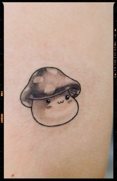 a small mushroom tattoo on the right thigh