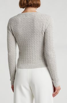 A cozy layering piece, this cable-knit sweater is knit from supersoft cashmere in a contemporary cropped silhouette. 20 1/2" length (size Small) Crewneck Long sleeves 100% cashmere Dry clean Imported Elegant Cashmere Cable Knit Sweater, Fitted Cashmere Cozy Sweater, Chic Cable Knit Cashmere Sweater, Fitted Cozy Cashmere Sweater, Cozy Fitted Cashmere Sweater, Merino Wool Cable Knit Long Sleeve Tops, Cable Knit Turtleneck Sweater For Layering, Cable Knit Merino Wool Cardigan, Winter Cashmere Cable Knit Top