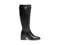 The Maya Rider is the epitome of equestrian inspired elegance, designed with a sleek and modern silhouette that effortlessly commands attention. This fashion-forward riding boot features an inside zipper for easy wear, while the ornamental strap adorned with a gold "M" adds a chic touch. Boot Straps, Riding Boot, Loafer Sneakers, Monk Strap, Shoe Care, Boot Sandals, Easy Wear, Riding Boots, Equestrian