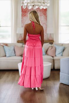 We love this halter maxi gown dress that has a criss cross cut out detail and ruffles! Fit: true to size with stretch making it an easy fit. Model is 5'6 wearing size small Pink Maxi Length Halter Dress For Date Night, Pink Ruched Halter Neck Maxi Dress, Pink Halter Neck Maxi Dress For Date Night, Date Night Halter Neck Maxi Dress With Crisscross Straps, Spring Maxi Dress With Crisscross Straps For Date Night, Maxi Dress With Crisscross Straps For Date Night, Chic Halter Neck Maxi Dress With Crisscross Straps, Fitted Maxi Dress With Crisscross Straps For The Beach, Fitted Maxi Dress With Crisscross Straps For Vacation