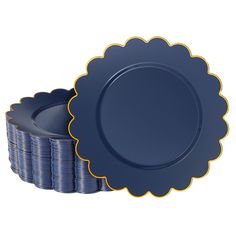 a stack of blue plates sitting next to each other