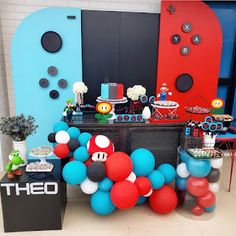 a mario birthday party with balloons and decorations