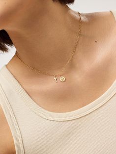 So chic and special, this gold pendant crafted in recycled solid gold features a coin-shaped silhouette and engraved detail for a timeless finishing touch. Solid Gold Chains, Letter Necklace, Gold Chain Necklace, Big Apple, Silhouette Design, Gold Pendant, Gold Chain, Gold Chains, Solid Gold