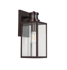 an outdoor wall light with a clear glass shade on the top and bottom half of it