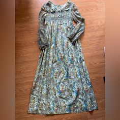 Nwt - This Dress Is From The 70’s. Excellent Condition. Tagged As Size 7 Juniors, However It Runs Small. Sleeves Are A Bit Sheer. Dress Is Extremely Well Made And Heavy Cotton Material. Blue Bohemian Dress With Gathered Sleeves, Bohemian Blue Dress With Gathered Sleeves, Spring Vintage Smocked Dress With Smocked Bodice, Vintage Style Smocked Dress For Spring, Flowy Prairie Dress For Daywear, Vintage Spring Dresses With Smocked Cuffs, Spring Vintage Dresses With Smocked Cuffs, Vintage Dresses With Smocked Cuffs For Spring, Spring Peasant Smock Dress