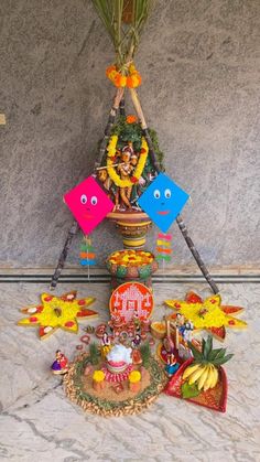 there are many decorations on the table with flowers and other things to decorate in front of it