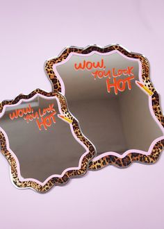 two mirrors with words on them that say wow you look hot and cheetah