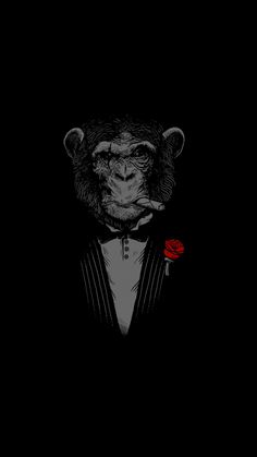 a monkey in a tuxedo with a red rose on his lapel collar