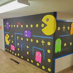 this is an image of a school hallway decorated with pacman and ghost wallpaper