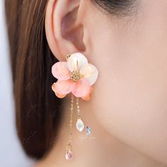 These elegant pink flower fashion earrings features a cute big pink flower and a long tail as back piece that you can wear with or without it. Add these cute flower fashion statement earrings to your everyday fashion earrings collection or as gift for your love one. Jewelry Care: See more information about how to care for your jewelry here. Shipping Policy: Orders will be shipped within 1-3 business days. Economy shipping will take 7-14 days to arrive and standard shipping is 1- 4 days for U.S. Dangle Flower Earrings With 3d Flowers, Feminine Dangle Flower Earrings, Trendy Pink Flower Earrings, Pink Petal Earrings For Party, Pink Feminine Dangle Flower Earrings, Feminine Pink Dangle Flower Earrings, Pink Feminine Flower Dangle Earrings, Elegant Pink Teardrop Flower Earrings, Trendy Pink Flower Drop Earrings