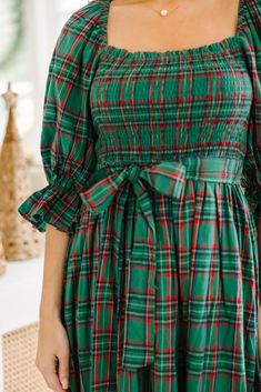 All I want for you is to be able to check out this adorable midi dress! It's so feminine and that tartan plaid print is absolutely perfect for the holiday season! This midi dress is going to look so good with heels or booties for any holiday party! Square neckline Smocked bust 3/4 sleeves with elastic cuffs Tied sash waist Plaid print No stretch however the smocking extends the bust *Plaid Colors: green, blue, red, yellow, white. Baileigh is wearing the small. Green Tartan Dress, Red Tartan Dress, Plaid Christmas Dress, Trendy Christmas Outfits, Green Tartan, Tartan Dress, Red Tartan, Colors Green, Model Fits