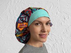 a woman wearing a colorful head scarf on top of her head