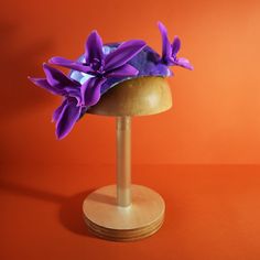 "Hand-crafted Hat in Purple color from the \"THALASSOPHILE\" Hat and Headpiece Collection by Stavroula P. Spyrou. *A NEW Collection inspired by the sea and Greece.  The word \"Thalassophile\" derives from the combination of the Greek words Thalassa (Θάλασσα: in English 'sea') and  Phile (Φίλος (friend): in English lover, beloved).  A unique hat with sequins embroidered by hand where you can wear it in any occasion, if you love appearances at the Royal Ascot, New Year's Eve or a birthday party. o Materials and Colors: -Iridescent transparent sequins in purple color -Cold Porcelain Exotic Flowers in purple color -Silk Shantung Lining and bias fabric in light salmon and light blue color -Double Elastic in ecru color and a silver comb (at the bottom) to keep the hat in place. -Size: Length: 25 Handmade Mini Hats For Royal Ascot, Handmade Adjustable Headpieces For Wedding, Handmade Adjustable Hats For Royal Ascot, Handmade Mini Hat With Structured Crown For Kentucky Derby, Elegant Adjustable Costume Hats And Headpieces For Ceremonies, Adjustable Hats For Kentucky Derby Celebration, Handmade Fitted Headpiece For Kentucky Derby, Adjustable Curved Brim Costume Hat For Ceremonies, Handmade Fitted Headpieces For The Kentucky Derby