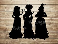 three silhouettes of women in dresses on wooden background