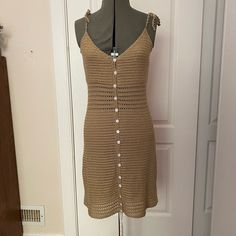 This Tan Colored Bodycon Crocheted Dress Has Pearled Button Down Front, Tied Spaghetti Straps, See Through Detail At Waistline & Hem. Perfect For A Summer Evening Out, Wedding Guest, Or As A Cover Up! Dress It Up Or Down. Summer Button-up Sundress For Beach, Beach Button-up Summer Sundress, Summer Button-up Beach Sundress, Summer Beach Sundress With Button-up Front, Summer Beach Mini Dress With Button Closure, Summer Beach Sundress With Button-up Design, Button-up Beach Sundress For Summer, Summer Beach Sundress With Button-up, Summer Beach Button-up Sundress