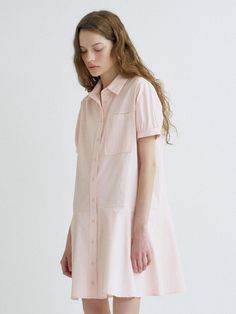 This is a trendy and feminine dress by ANEDIT that is made out of high quality and sturdy material. With distinctive mood of the design and modern feminine look, you can style it for your comfortable daily outfit.- Feminine mood and soft touch- Semi loose silhouette- Subtle puff sleeves and flared skirt- Out pocket detail on the chest Feminine Cotton Shirt Dress For Day Out, Pink Cotton Midi Dress For Daywear, Feminine Cotton Shirt Dress For Spring, Feminine Spring Cotton Shirt Dress, Pink Cotton Shirt Dress For Day Out, Feminine Shirt Dress For Day Out, Midi Length, Trendy Relaxed Fit Shirt Dress For Daywear, Pink Relaxed Fit Midi Dress For Summer, Pink Midi Length Shirt Dress For Daywear