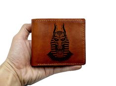 "All products are made from genuine veg-tan leather wallet and made by hand. --- OVERVIEW --- - Size: 11cm x 9.5cm (~ 4.3 inch x 3.7 inch) - High quality cowhide, handmade - Ancient Egypt insect design is engraved in front side of the wallet. The leather handmade men wallet have 10 COLORS, 05 STYLES OF WALLET, NAME/TEXT/IMAGE... ENGRAVING --- CUSTOMIZATION --- - With an extra charge of US$5/each name/initials/image in each side, personalized request will be made as your idea. - For customization