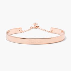 Simple yet sophisticated, the elegance of the Gwen Cuff Bracelet makes it an instant classic. Personalize it with your name or the name of a loved one in your choice of engraving styles. Available in 14k gold plated, rhodium plated or 14k rose gold plated brass Width: 1/4" Length: 5 1/2" With engraving this item is FINAL SALE SKU: BYB1031 Elegant Rose Gold Name Bracelet For Formal Occasions, Elegant Engraved Rose Gold Bracelet, Luxury Rose Gold Name Bracelet For Formal Occasions, Luxury Rose Gold Name Bracelet For Formal Events, Minimalist Rose Gold Bracelet With Custom Name, Adjustable Elegant Rose Gold Cuff Bracelet, Adjustable Elegant Name Bracelet With Engraving Option, Elegant Adjustable Name Bracelet With Engraving Option, Personalized Name Bracelet In Rose Gold