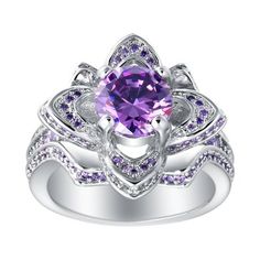 The Violet statement ring from the distinguished Ginger Lyne Collection is a true testament to unmatched elegance and intricate craftsmanship. Drawing inspiration from the poetic beauty of flowers. Violet statement ring from the distinguished Ginger Lyne Collection is a true testament to unmatched elegance and intricate craftsmanship. Drawing inspiration from the poetic beauty of flowers, this piece showcases a breathtaking design that elegantly blossoms with a vivid purple cubic zirconia stone Birthday Gemstones, Flower Purple, Cubic Zirconia Engagement Rings, Anniversary Wedding Band, Ring Flower, Purple Love, All Things Purple, Cubic Zirconia Rings, Ring Setting