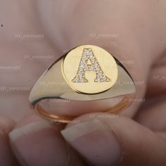 This ring is made with Genuine 0.10 Ct. SI Clarity G-H Color Diamond 'A' Initial Signet Ring Solid 14k Yellow Gold Personalized Party Wear Jewelry/ Bridesmaid Gift. * SKU: SR01012 * Made to Order. * Gold Purity: 14K Solid Yellow Gold (stamped) * Custom Gold Color: Yellow, Rose, White Gold * Custom Gold Purity: 9K/14K/18K (Charges Apply) * Diamond 100% Genuine Diamond * Diamond Weight: 0.10 ct. * Diamond Color: G-H * Diamond Clarity: SI1- SI2 * Diamond Cut: Brilliant Cut (Excellent) Product Measu Classic Personalized Cubic Zirconia Diamond Ring, Personalized Classic Cubic Zirconia Diamond Ring, 14k White Gold Initial Ring With Diamond Accents, Personalized Diamond Initial Ring, Personalized Diamond Initial Ring For Anniversary, Personalized Yellow Gold Diamond Ring In Sterling Silver, Fine Jewelry Initial Ring With Diamond Accents, 14k White Gold Promise Ring, Personalized Yellow Gold Rings With Cubic Zirconia