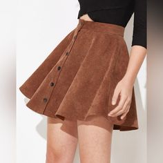 Tan Flowy Skirt Size Medium Never Worn Casual A-line Mini Skirt For Winter, Casual Brown A-line Skirt, Brown A-line Skirt For Spring, Spring Brown A-line Skirt, Brown Skirt With Button Closure For Summer, Brown Button Closure Skirt For Summer, Trendy Brown Skirt For Day Out, Winter Mini Skirt For Day Out, Flowy Skort For Fall