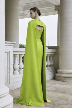 Silk Cape Dress For Gala, Elegant Fitted Cape Gown, Elegant Fitted Gown With Cape, Silk Gown With Cape Sleeves, Cape Evening Dress With Draped Sleeves For Wedding, Elegant Evening Gown With Cape, Luxury Cape Dress For Formal Occasions, Elegant Silk Cape For Formal Occasions, Cape Evening Dress With Sweep Train For Gala