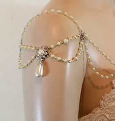 the back of a woman's bra with pearls on it