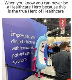 a man standing next to a sign that says, when you know you can never be a healthcare hero because this is the true hero of healthcare