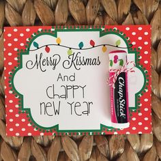 a merry christmas and happy new year card with a candy bar on it's side