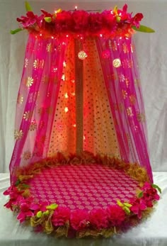 the bed is decorated with pink and orange flowers