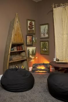 two bean bag chairs sitting in front of a fireplace