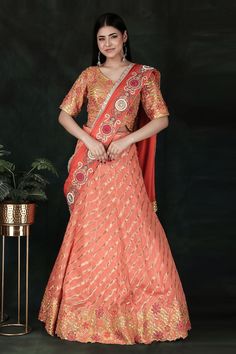 Orange woven lehenga saree with floral, thread and leheriya hand embroidered pallu. Comes with a yellow padded blouse and a petticoat with an attached cancan. - Aza Fashions Raw Silk Choli With Traditional Drape For Festivals, Traditional Drape Raw Silk Choli For Festivals, Art Silk Choli With Zari Work In Traditional Drape, Dola Silk Lehenga With Dori Work For Navratri, Reception Banarasi Silk Semi-stitched Dupatta, Bollywood Style Raw Silk Choli With Pallu, Bollywood Style Choli With Pallu In Raw Silk, Traditional Tissue Silk Lehenga With Traditional Drape, Art Silk Choli With Zari Work